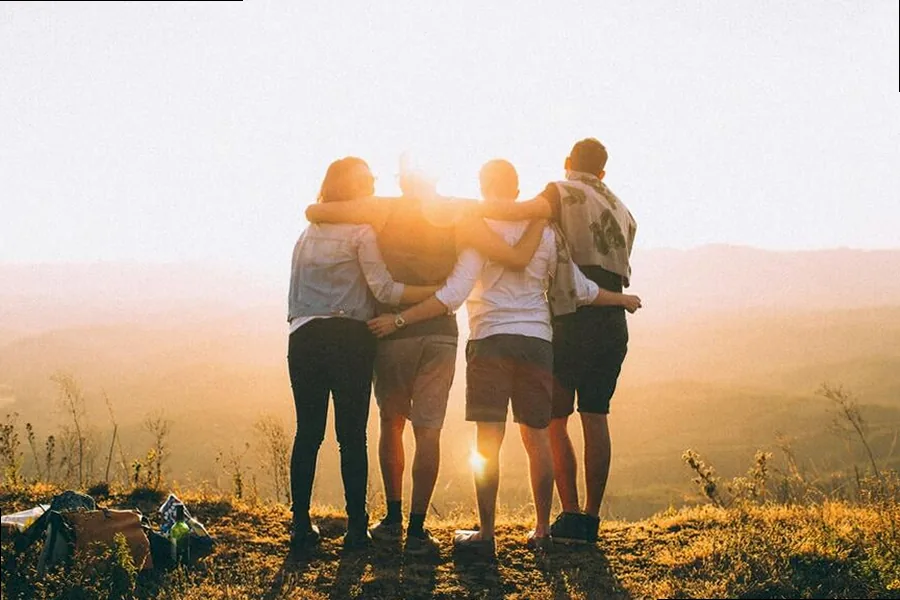 Two friends enjoying a beautiful sunset, capturing an aesthetic and serene friendship moment
