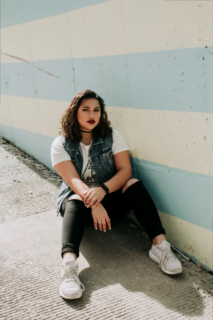 A confident person with a strong pose, embodying a badass vibe.