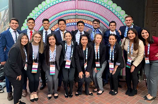 Diverse group of engineering students collaborating on a project, showcasing teamwork and innovation.