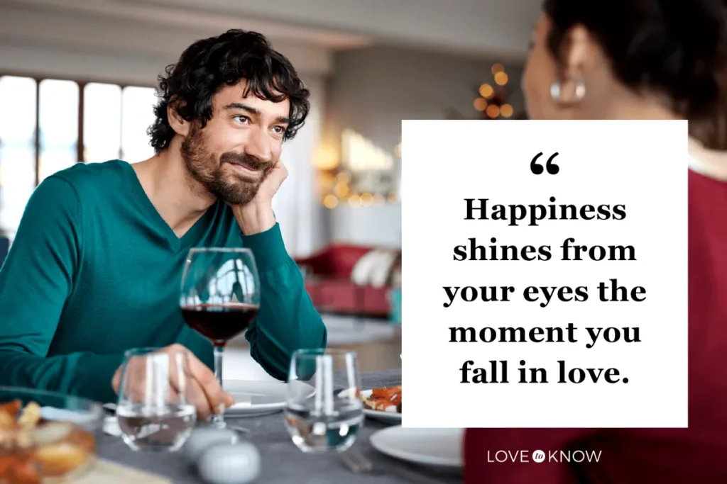 Smiling couple enjoying a meal together, radiating happiness.