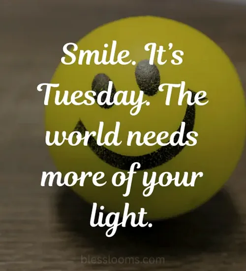 A person smiling brightly with sunlight, radiating happiness and positivity.