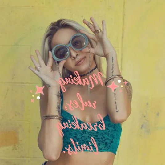 A stylish woman with a confident expression, representing savage beauty and self-assurance.