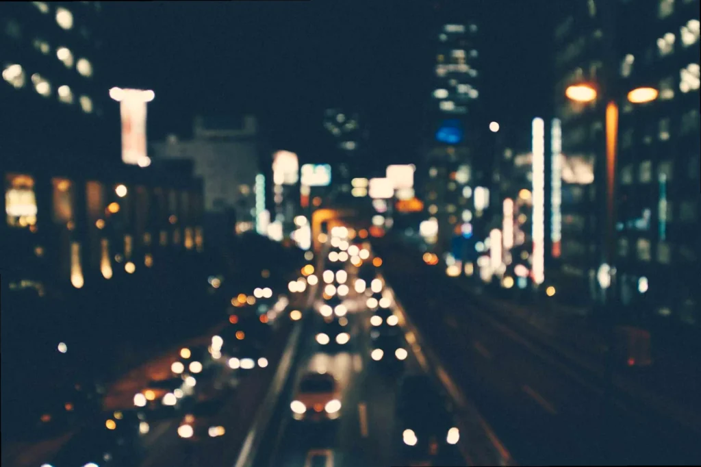 Blurred city lights at night, symbolizing a long distance connection for good night messages