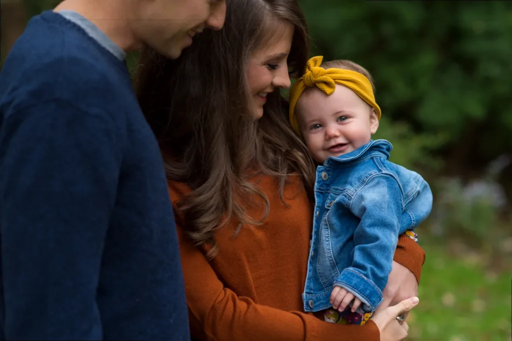 Close-up of a baby's first photos, highlighting tiny hands and feet.