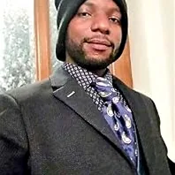 A person gazing thoughtfully into the distance, symbolizing overcoming internal struggle and finding clarity.