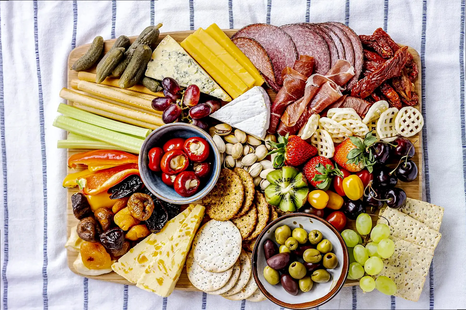 A close-up, warm-toned food photograph of a dessert with berries and cream.