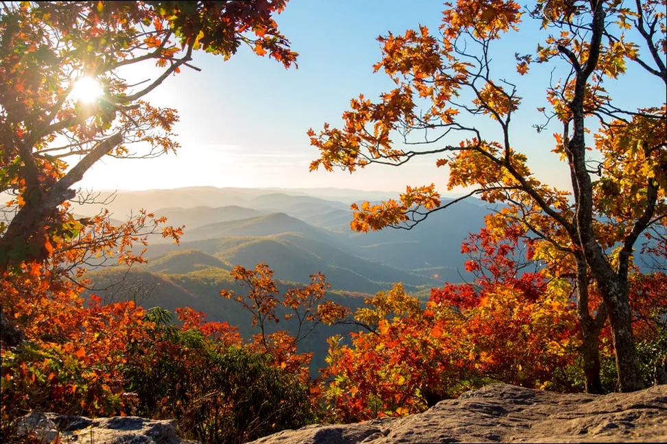Vibrant fall sunset over Georgia mountains, showcasing golden hour light