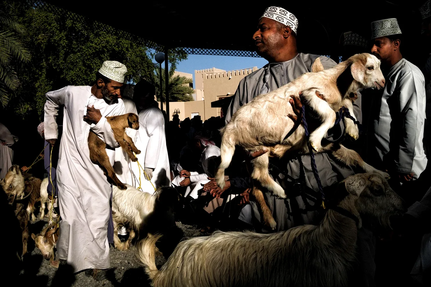 A candid street photograph capturing a moment of intense observation in an urban setting.