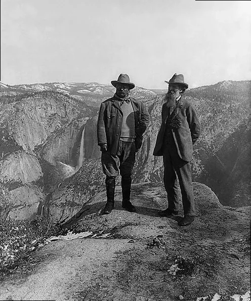 U.S. President Theodore Roosevelt (left) and nature preservationist John Muir, founder of the Sierra Club, on Glacier Point in Yosemite National Park, embodying perseverance and appreciation for nature's challenges.