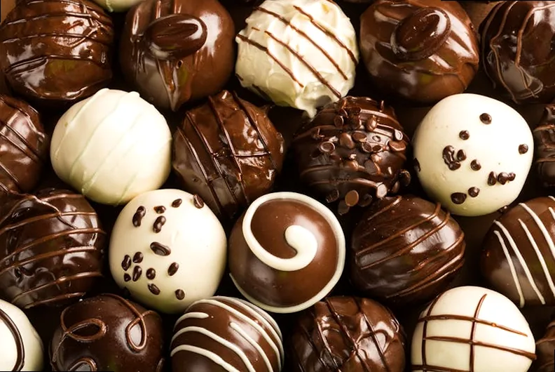 A close-up of various chocolate pieces, inviting indulgence.