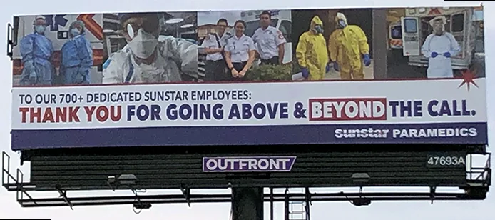 Large billboard thanking EMS professionals for their service during EMS Week