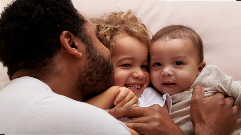 A joyful family silhouette, symbolizing unity, love, and togetherness against a warm backdrop.