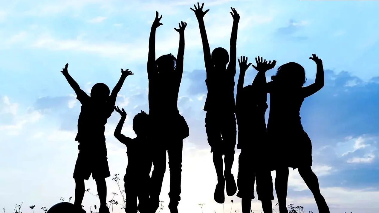 Children's Day celebration with smiling children holding balloons and gifts