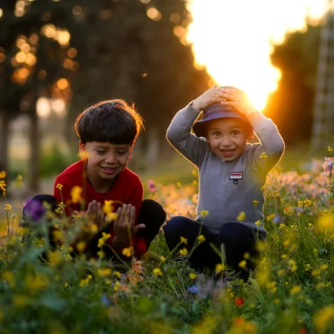Children collaborating on a creative project, fostering curiosity and growth.