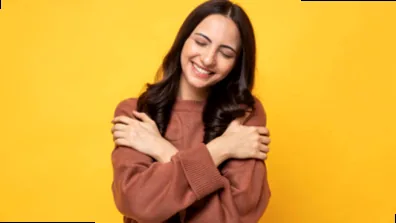 A generic stock photo of a diverse group of people smiling, hinting at the performative nature of happiness.